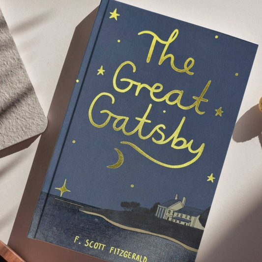 Book titled 'The Great Gatsby' by F. Scott Fitzgerald on a white surface.