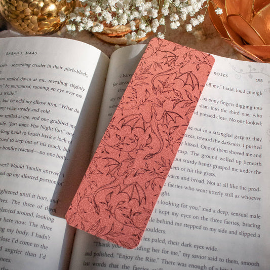 Decorative floral bookmark on an open book with a soft focus background