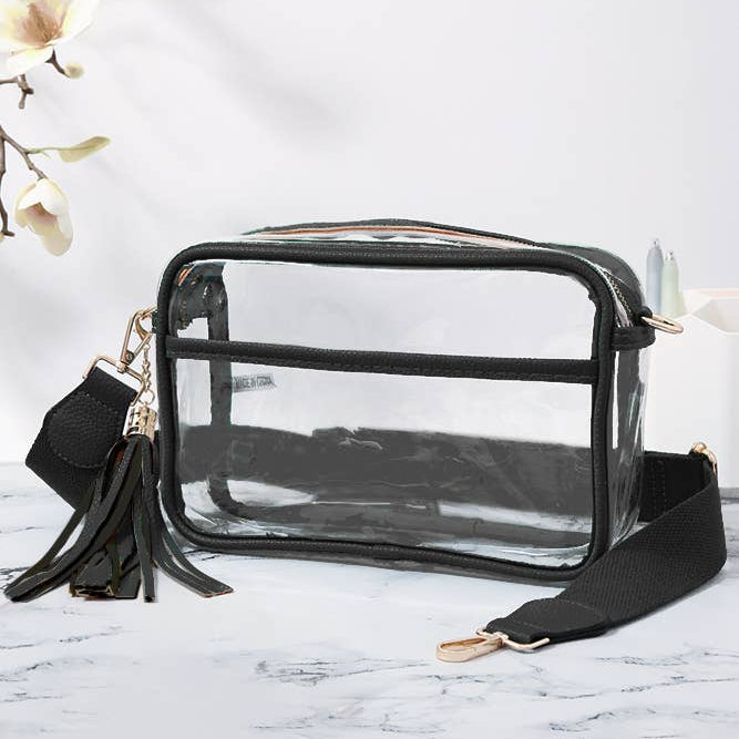 Clear handbag with black accents on a marble surface
