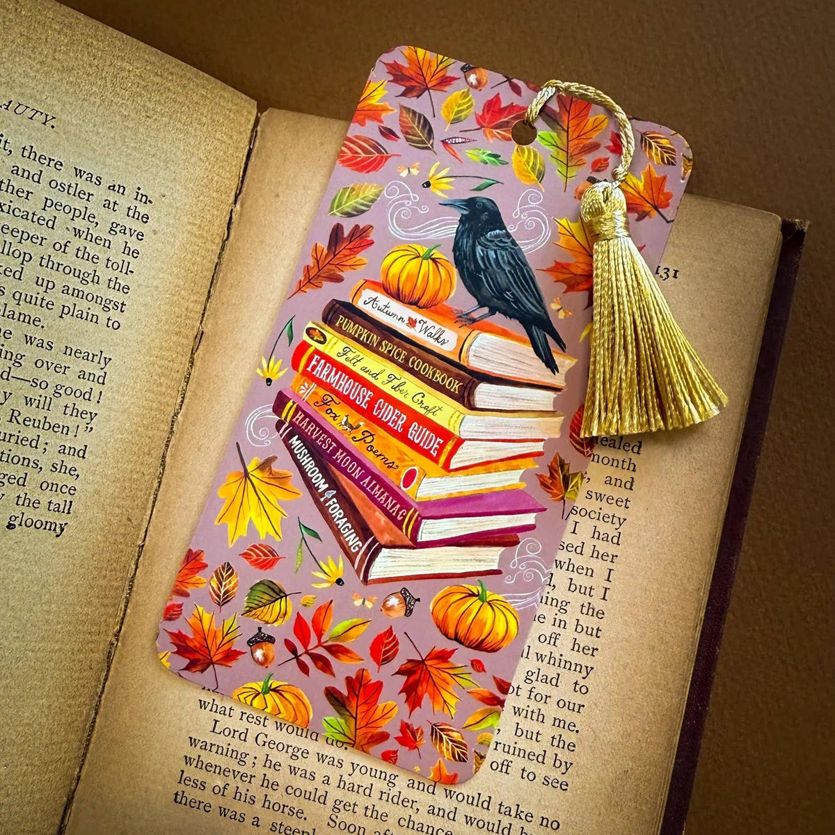 Decorative bookmark with autumn design on an open book