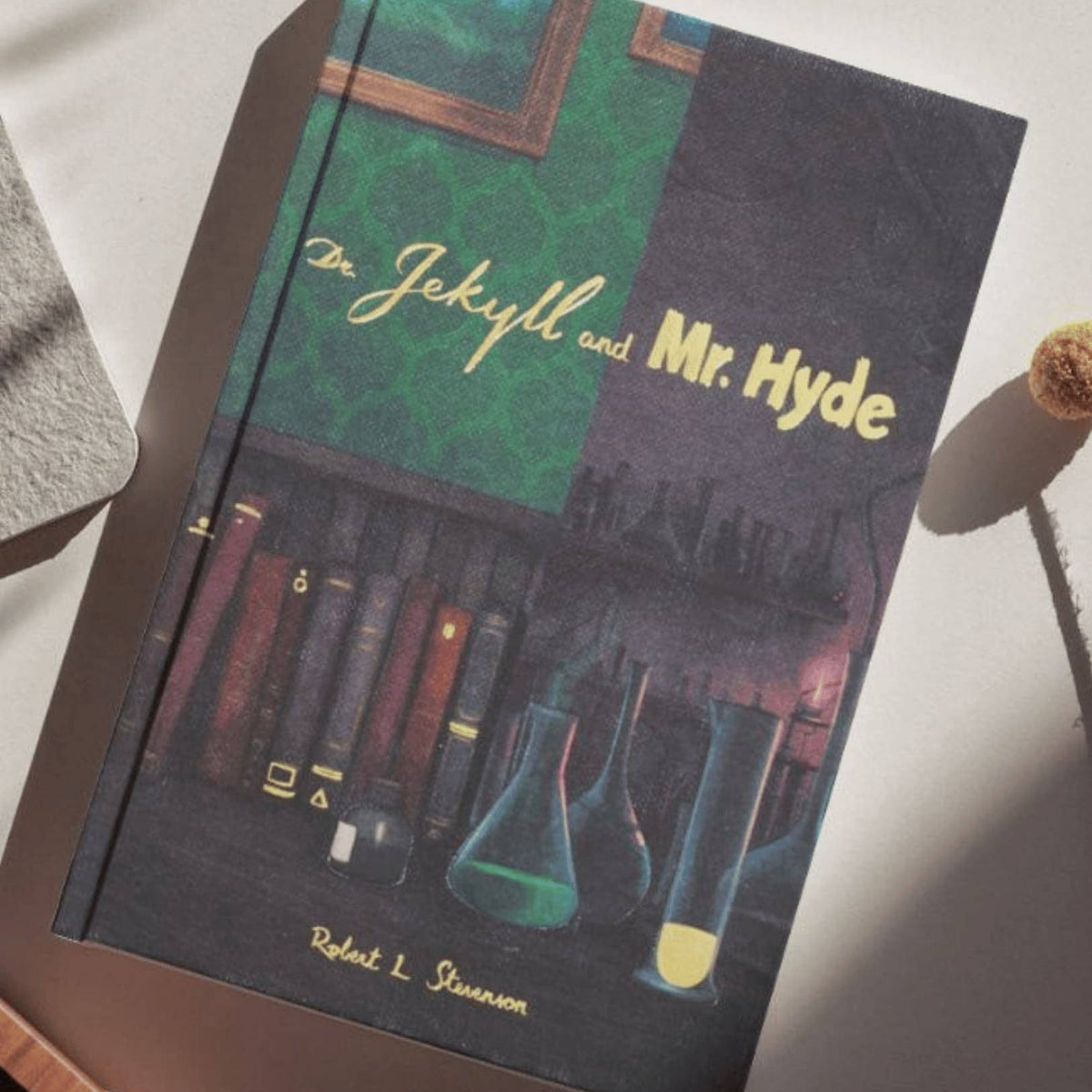 Book cover of 'Dr. Jekyll and Mr. Hyde' on a surface