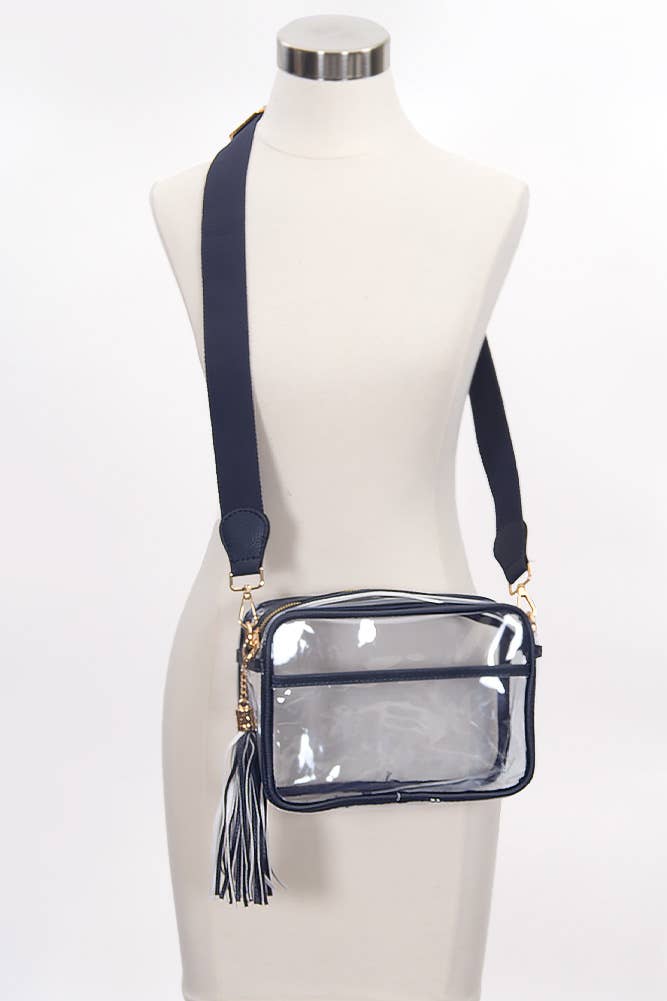 Clear crossbody bag with navy strap on a mannequin against a white background