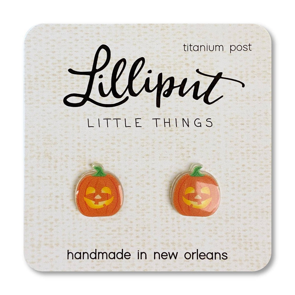 Lilliput Little Things pumpkin earrings on a branded card.