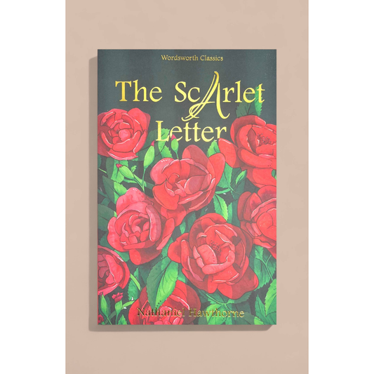 The Scarlet Letter book cover by Nathaniel Hawthorne, featuring red roses on a dark background with gold lettering, displayed against a beige wall.
