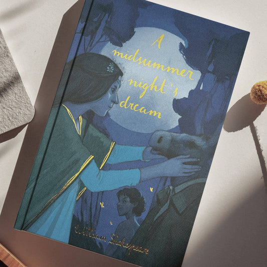 Book titled 'A Midsummer Night's Dream' by William Shakespeare on a white surface.