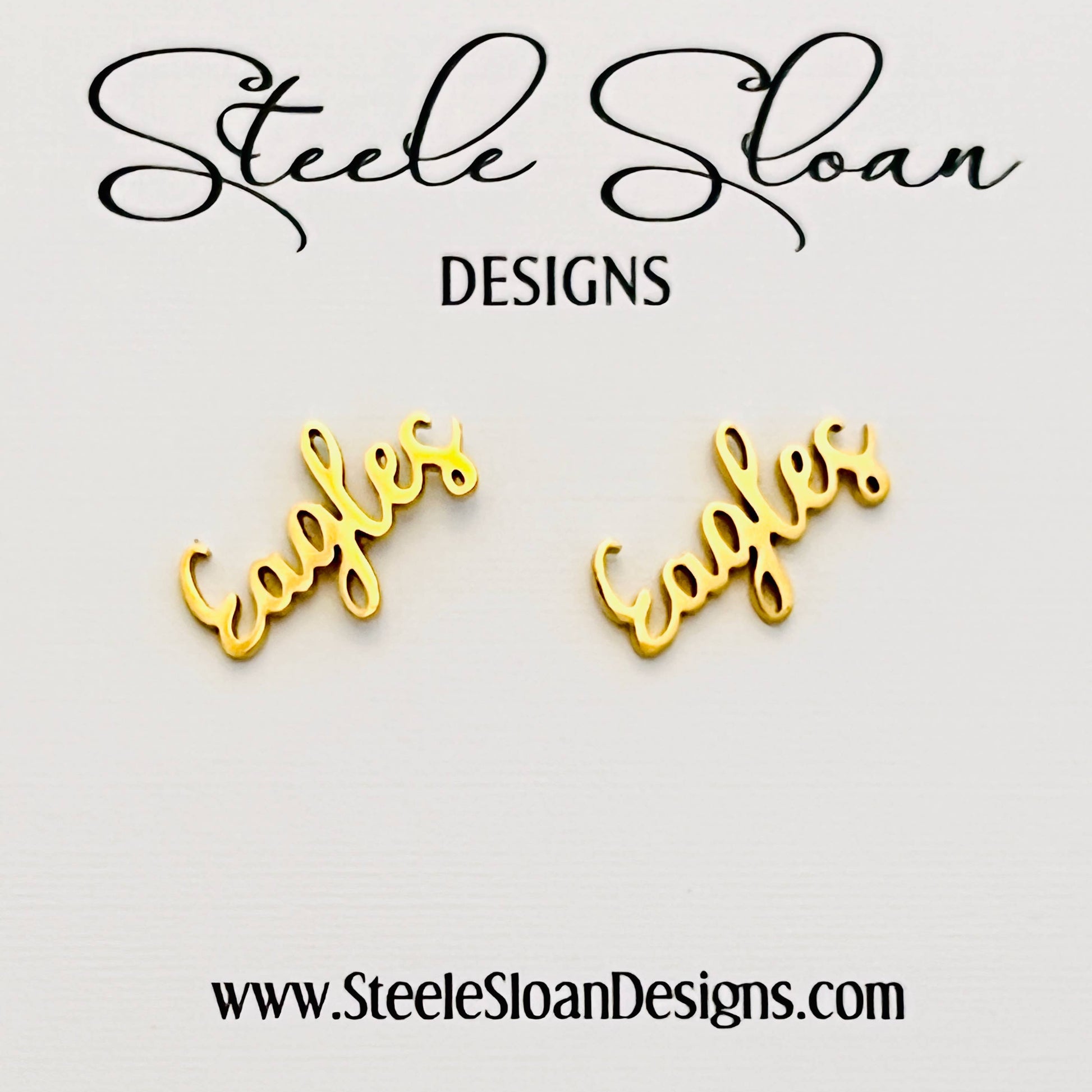 Gold 'Eagles' earrings with 'Steele Sloan Designs' branding on a light gray background.